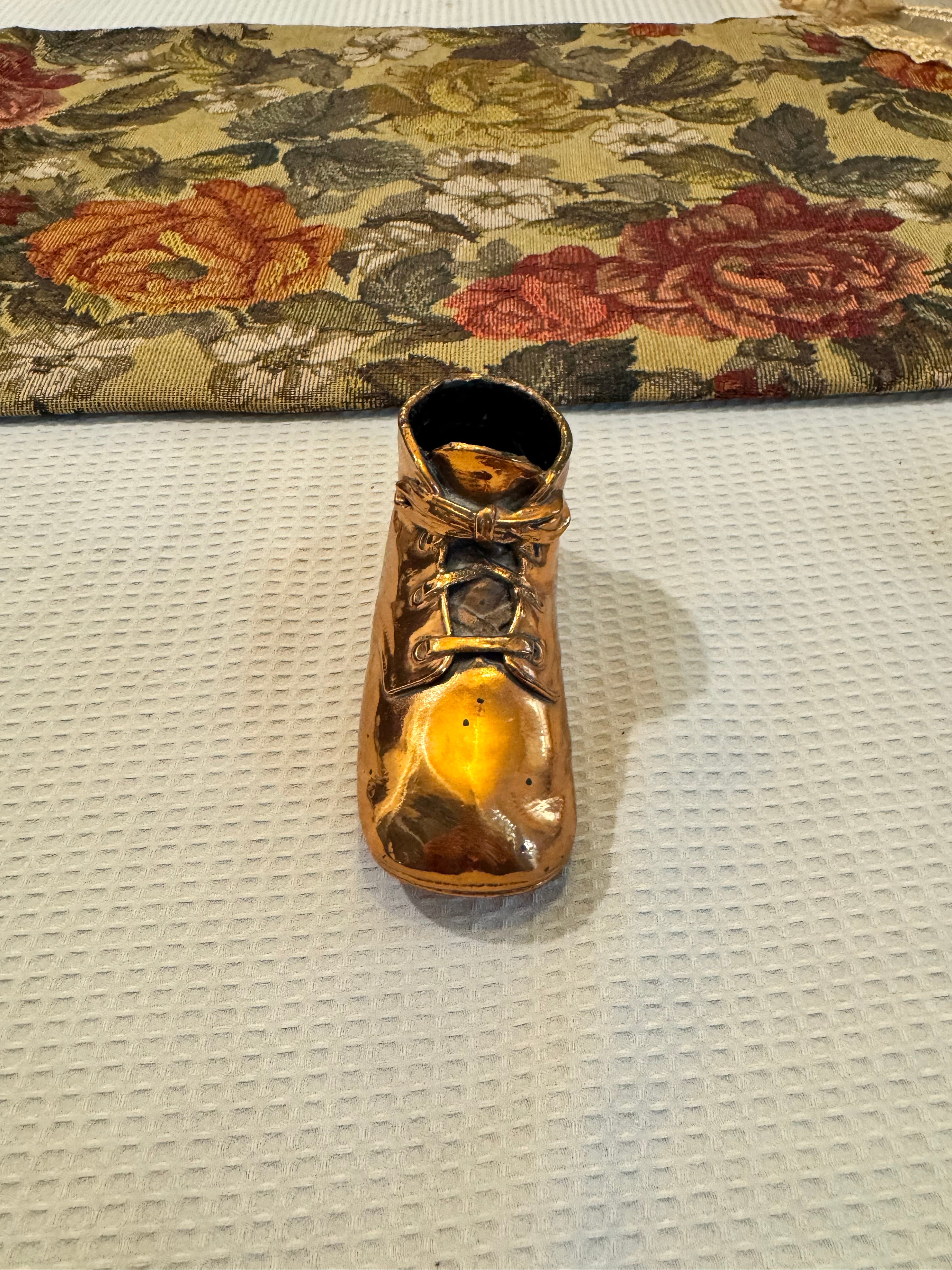 Vintage copper-dipped baby shoe