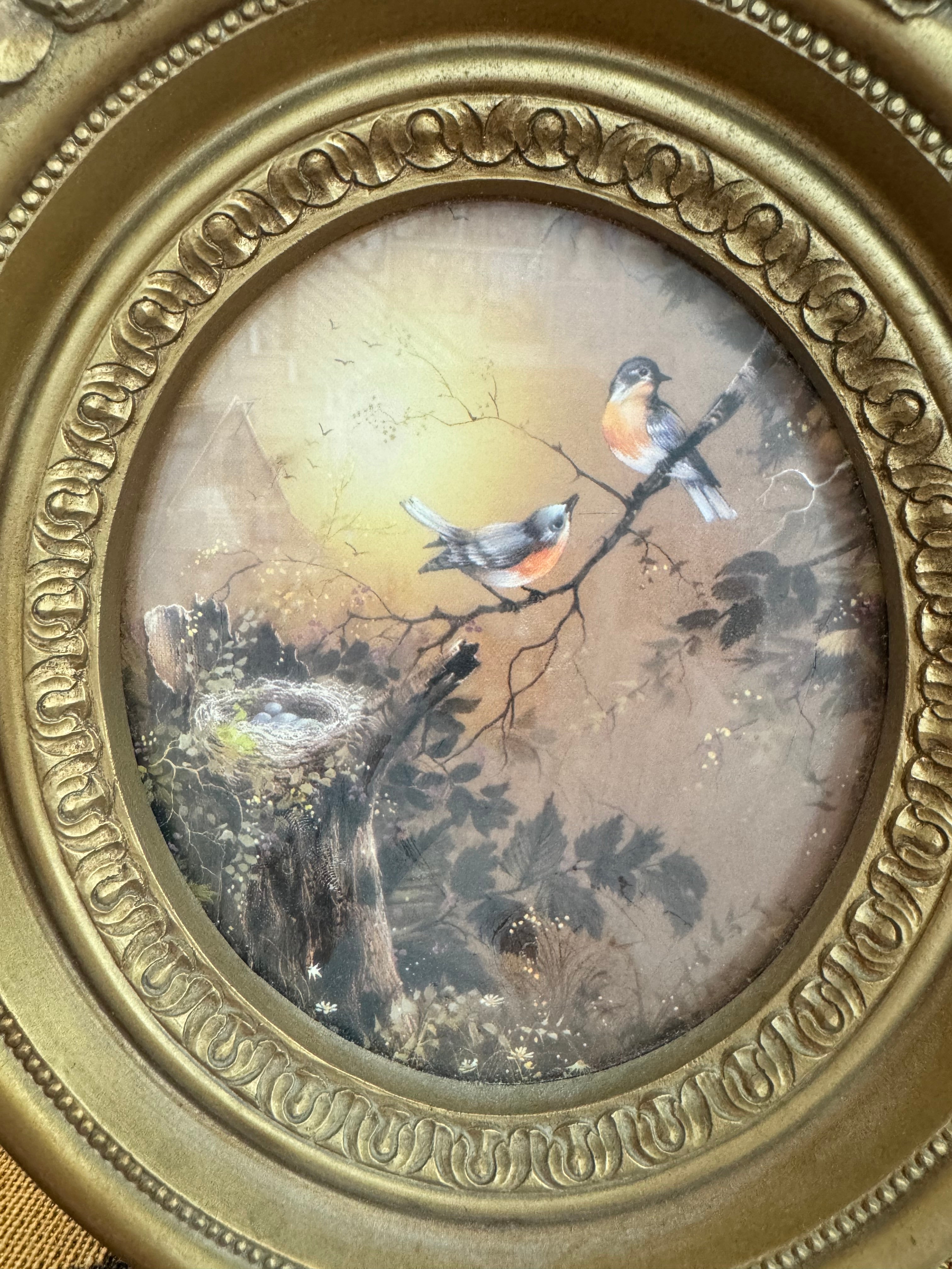 Vintage Homco blue birds and a nest print in an ornate gold oval frame by artist Margie Morrow