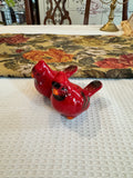 Collectible cardinal salt and pepper shakers appear ceramic figurines by Robert Stanley.