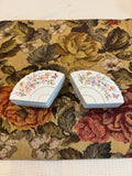 A pair of vintage 1980 Avon porcelain fan-shaped trinket boxes