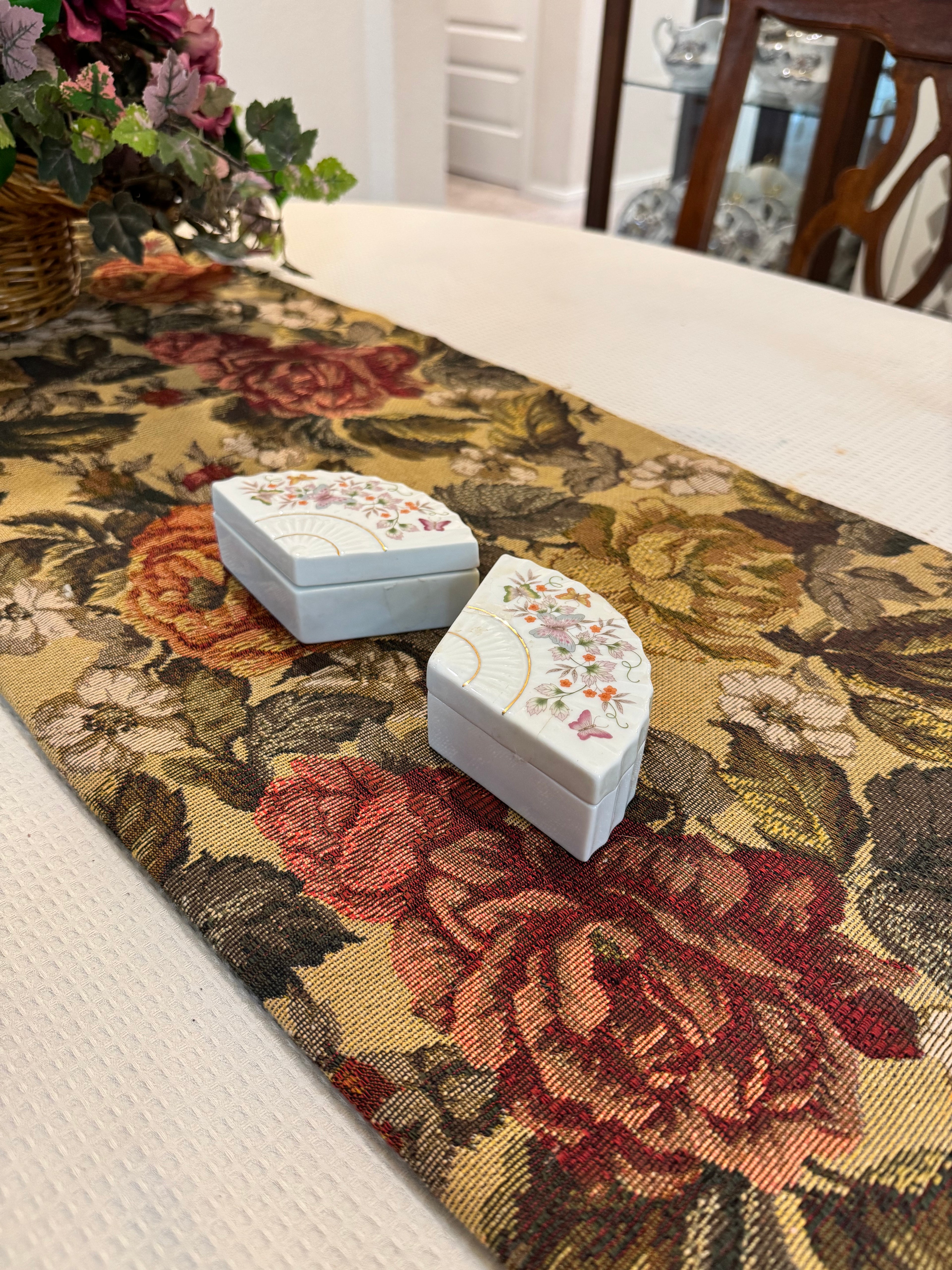 A pair of vintage 1980 Avon porcelain fan-shaped trinket boxes