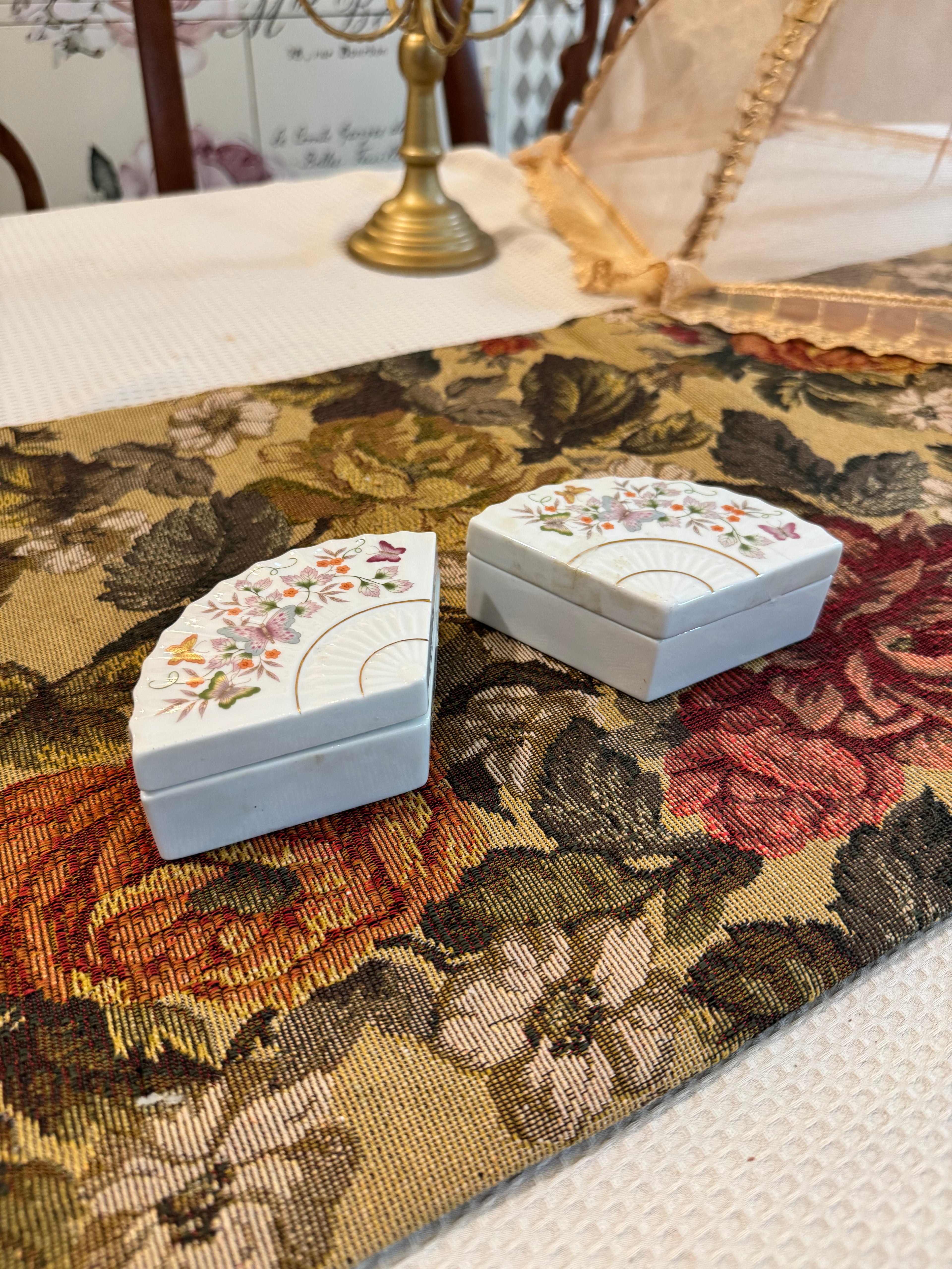 A pair of vintage 1980 Avon porcelain fan-shaped trinket boxes
