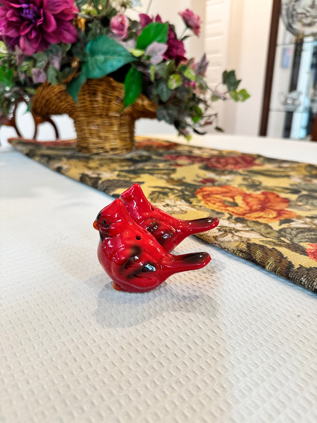 Collectible cardinal salt and pepper shakers appear ceramic figurines by Robert Stanley.