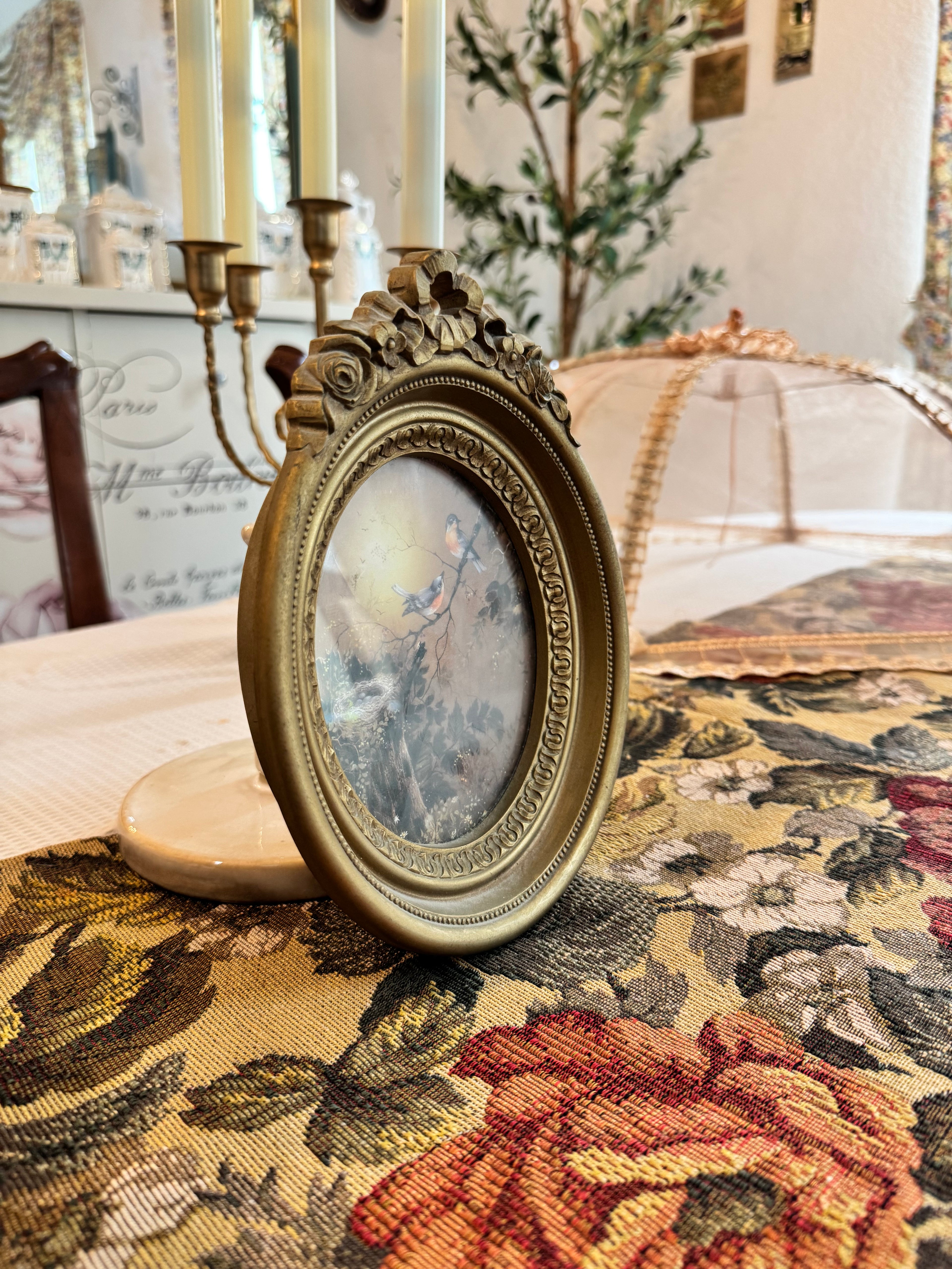 Vintage Homco blue birds and a nest print in an ornate gold oval frame by artist Margie Morrow
