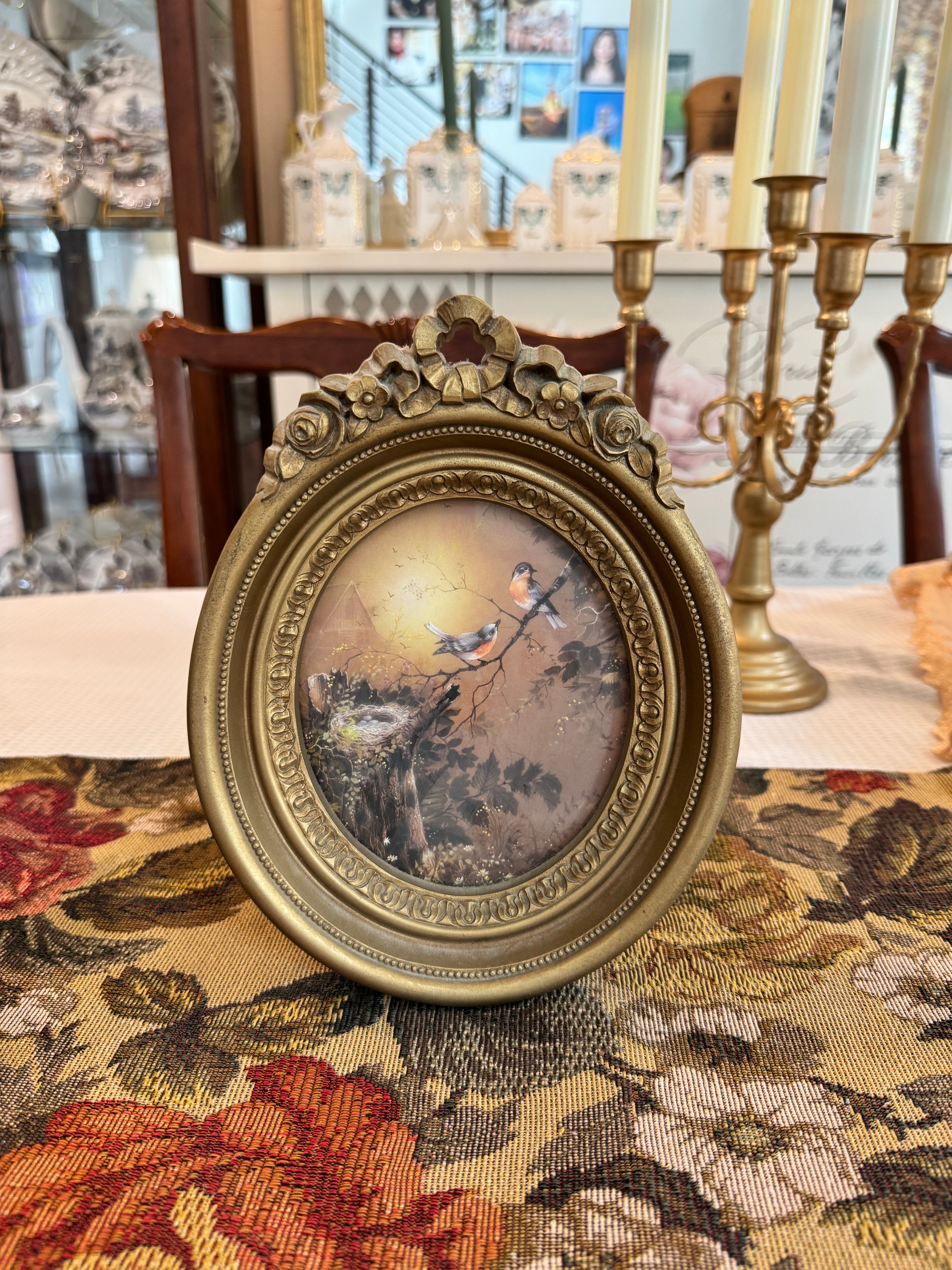 Vintage Homco blue birds and a nest print in an ornate gold oval frame by artist Margie Morrow