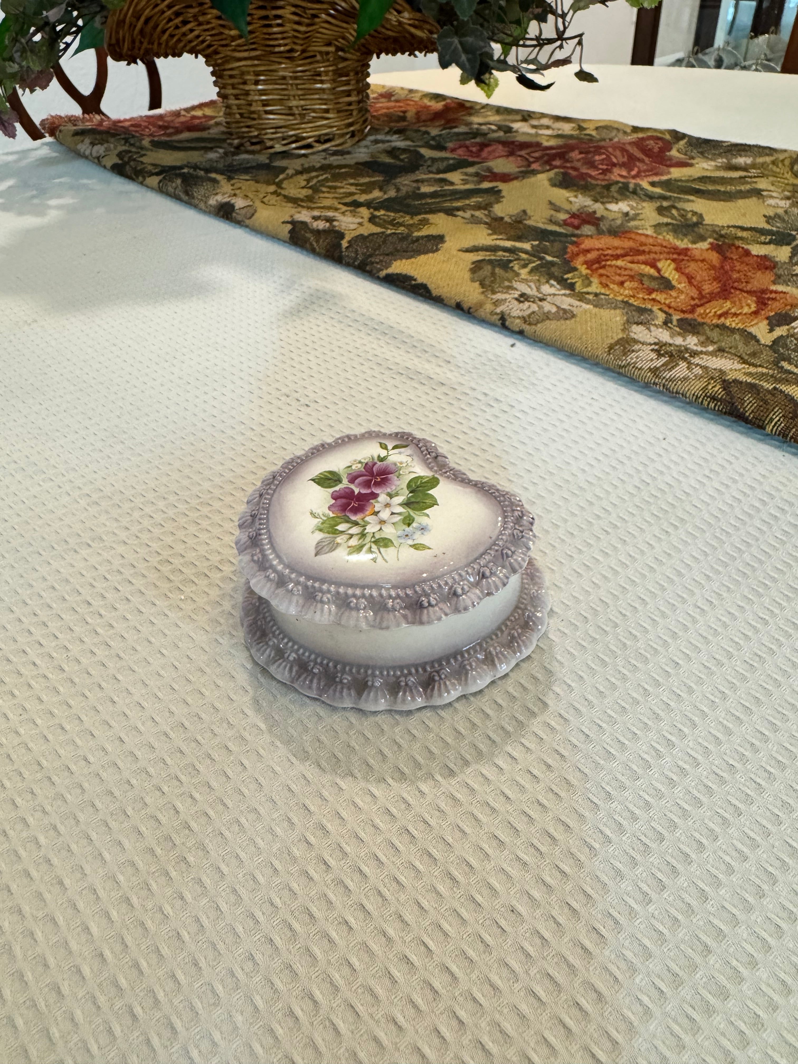 Vintage-style porcelain or ceramic heart-shaped trinket box