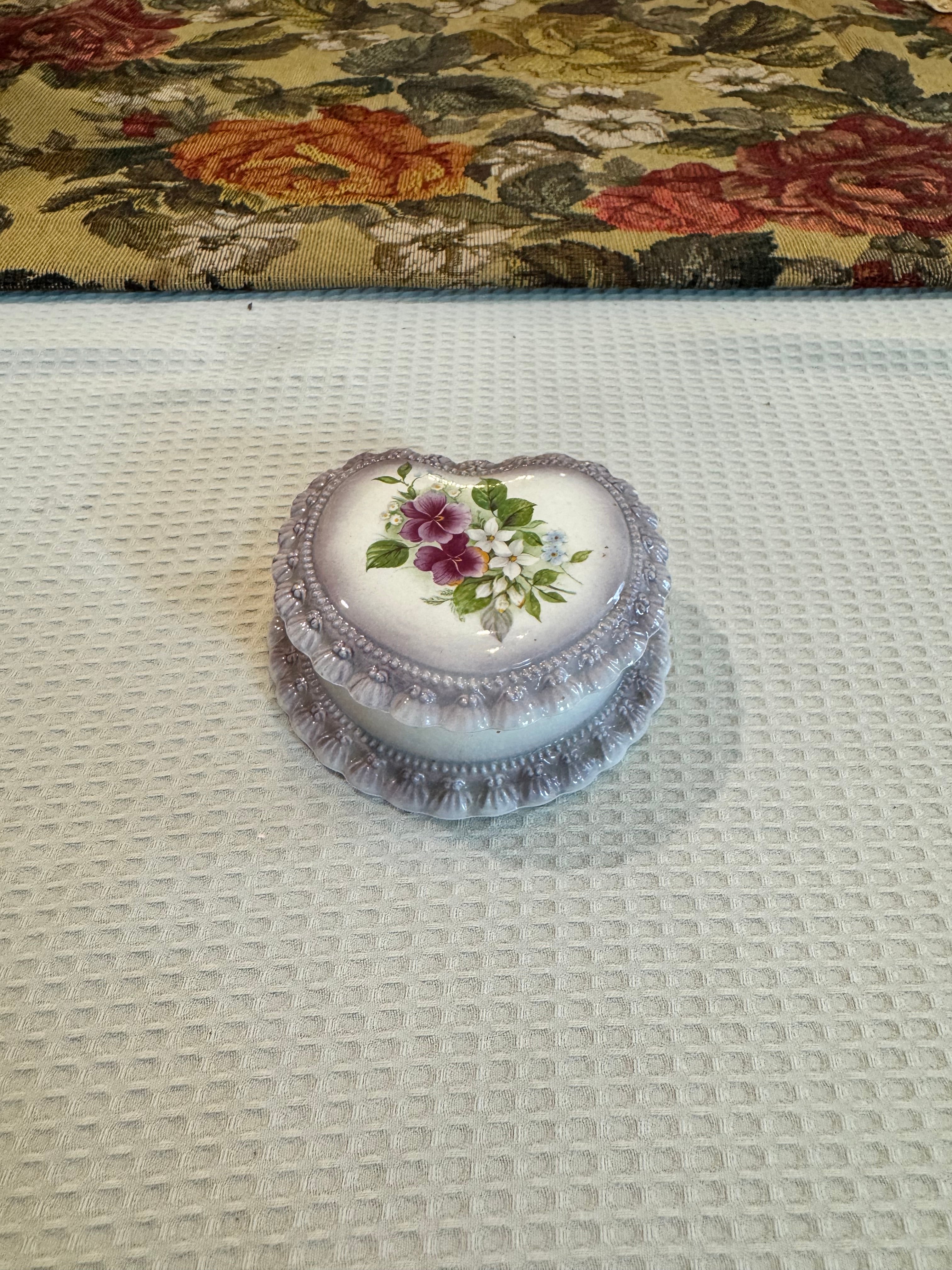 Vintage-style porcelain or ceramic heart-shaped trinket box