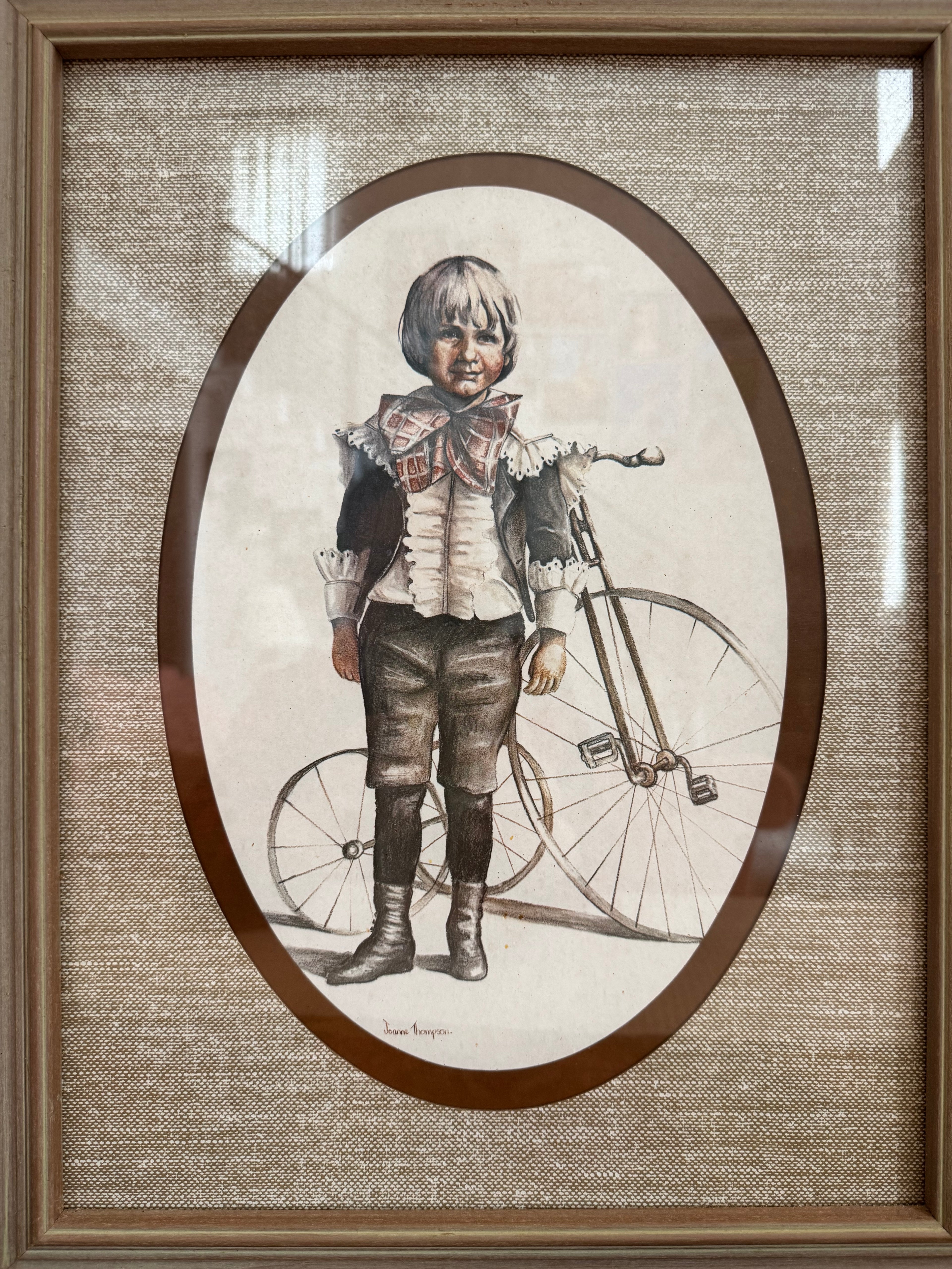A pair of victorian framed prints boy and girl by artist Joanne Thompson