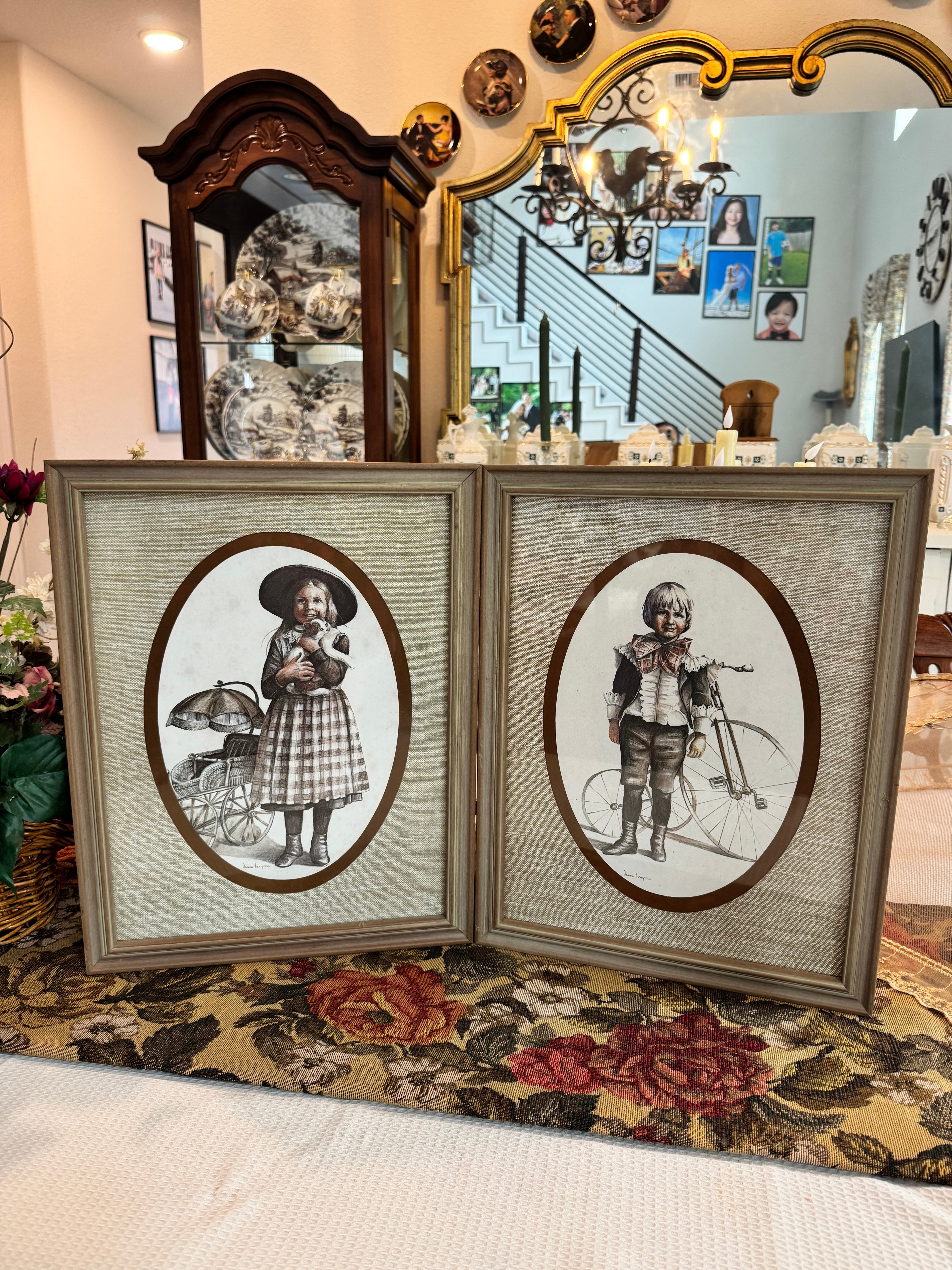 A pair of victorian framed prints boy and girl by artist Joanne Thompson