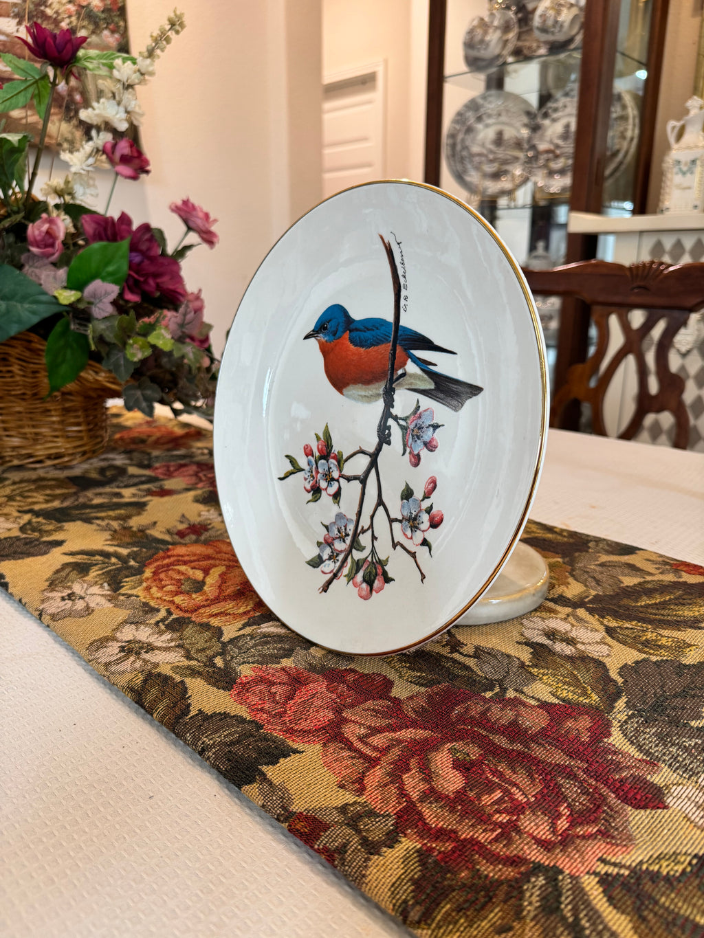 Collectible Avon North American Songbird Plate with a bluebird by artist Don Eckelberry.