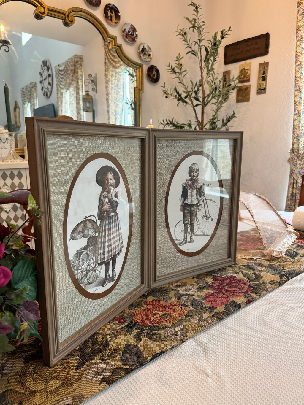 A pair of victorian framed prints boy and girl by artist Joanne Thompson