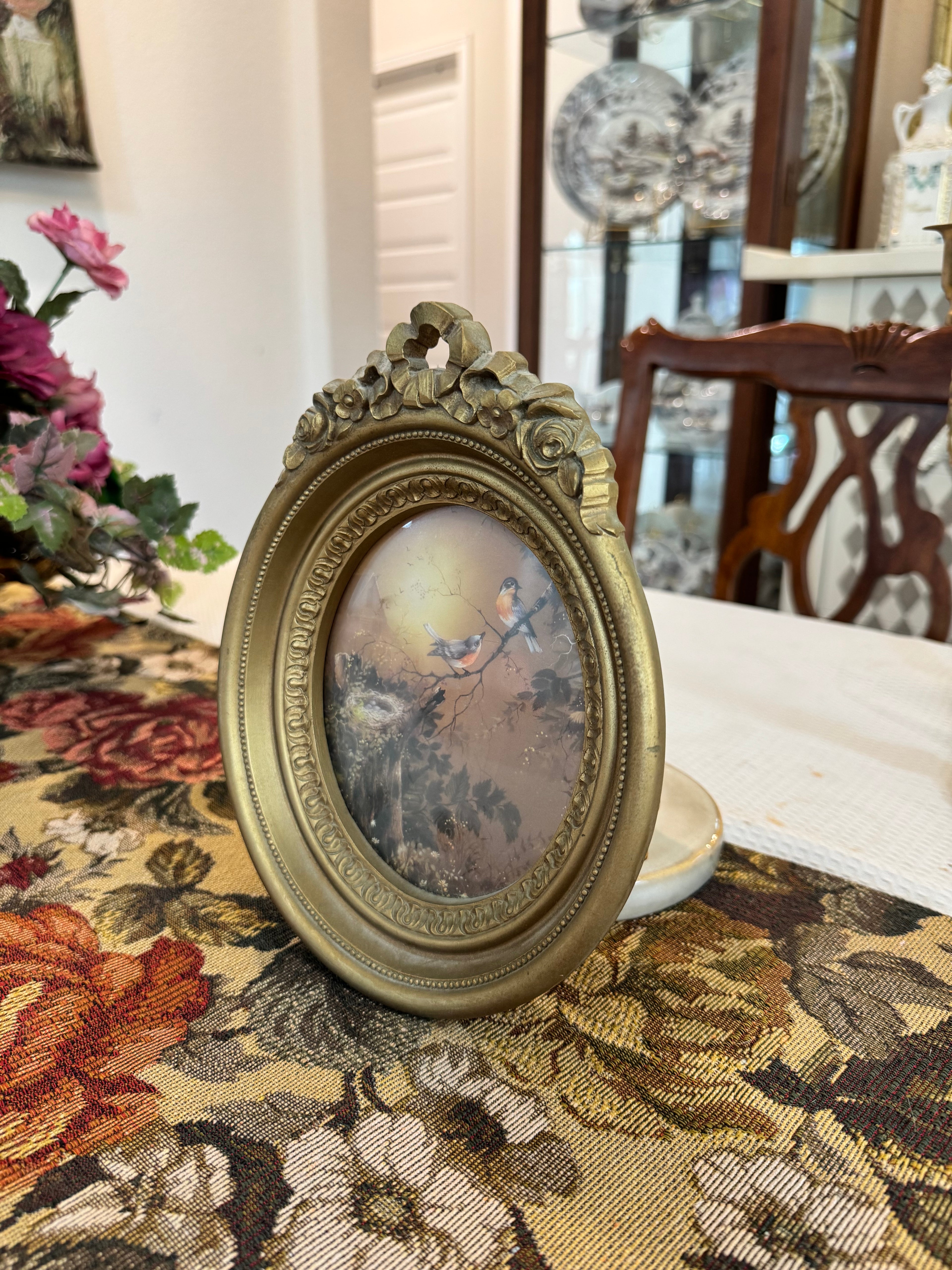 Vintage Homco blue birds and a nest print in an ornate gold oval frame by artist Margie Morrow