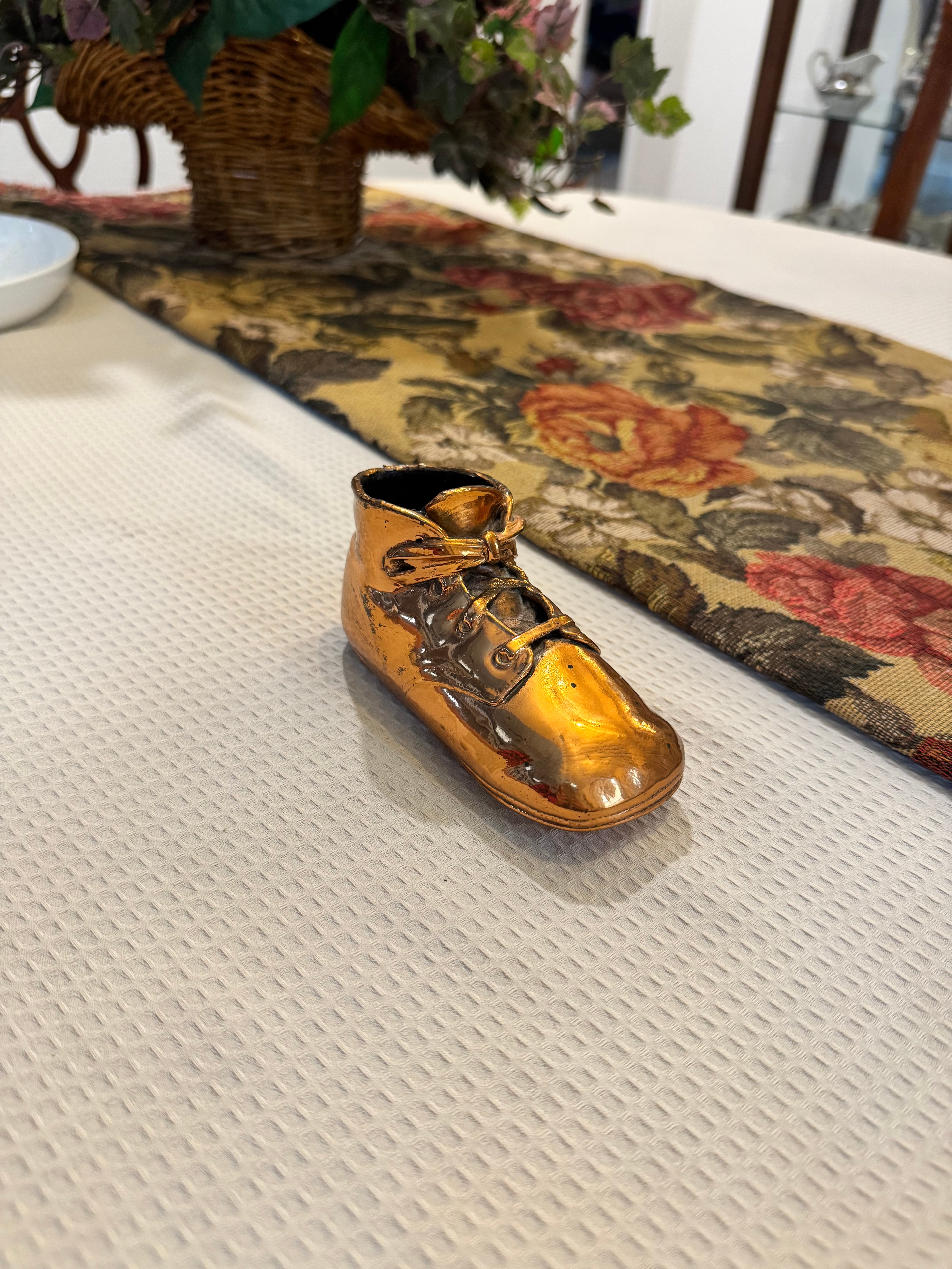 Vintage copper-dipped baby shoe
