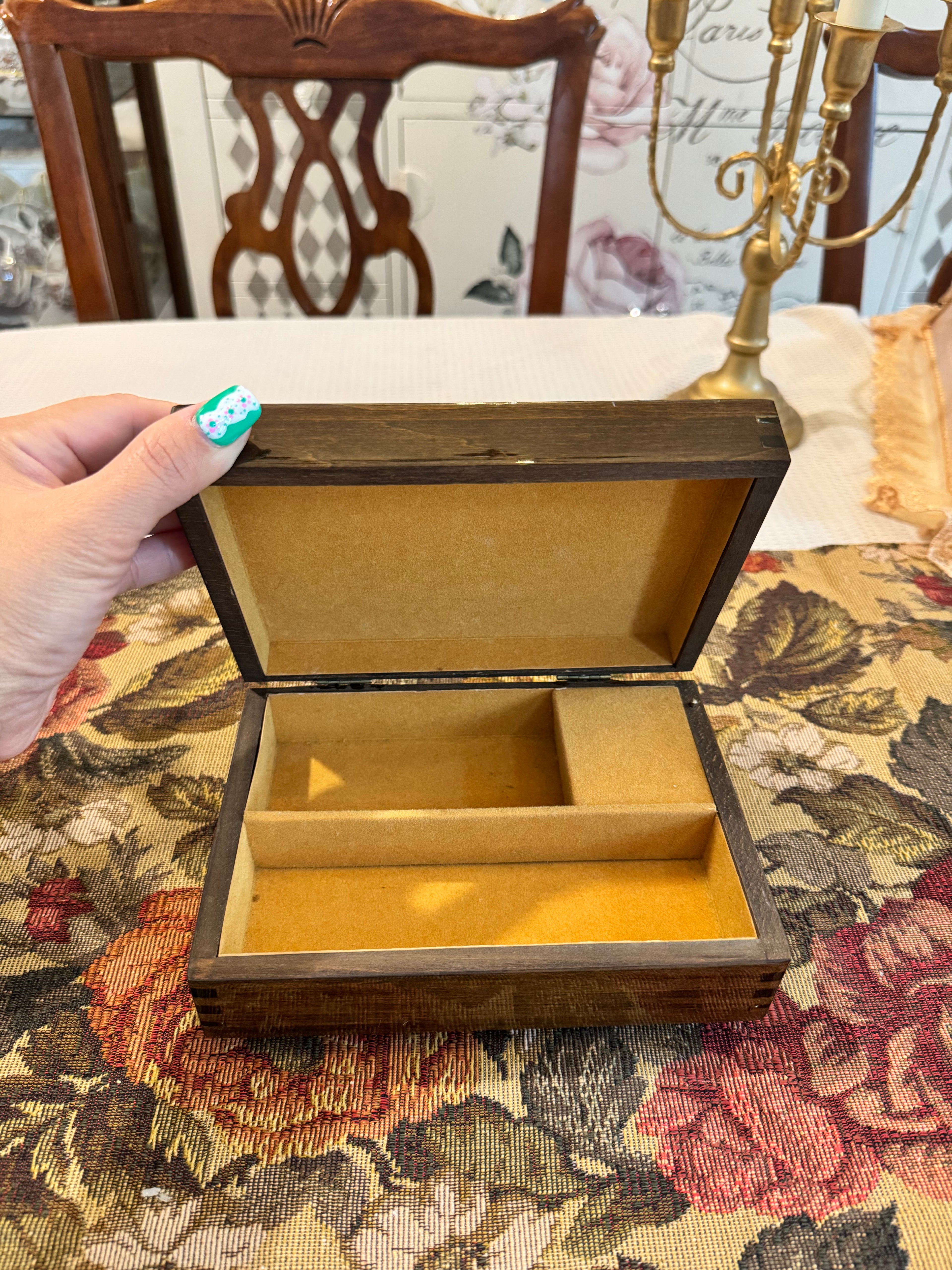 Wooden decorative musical jewelry box featuring a reproduction of the painting "The Wedding Register"