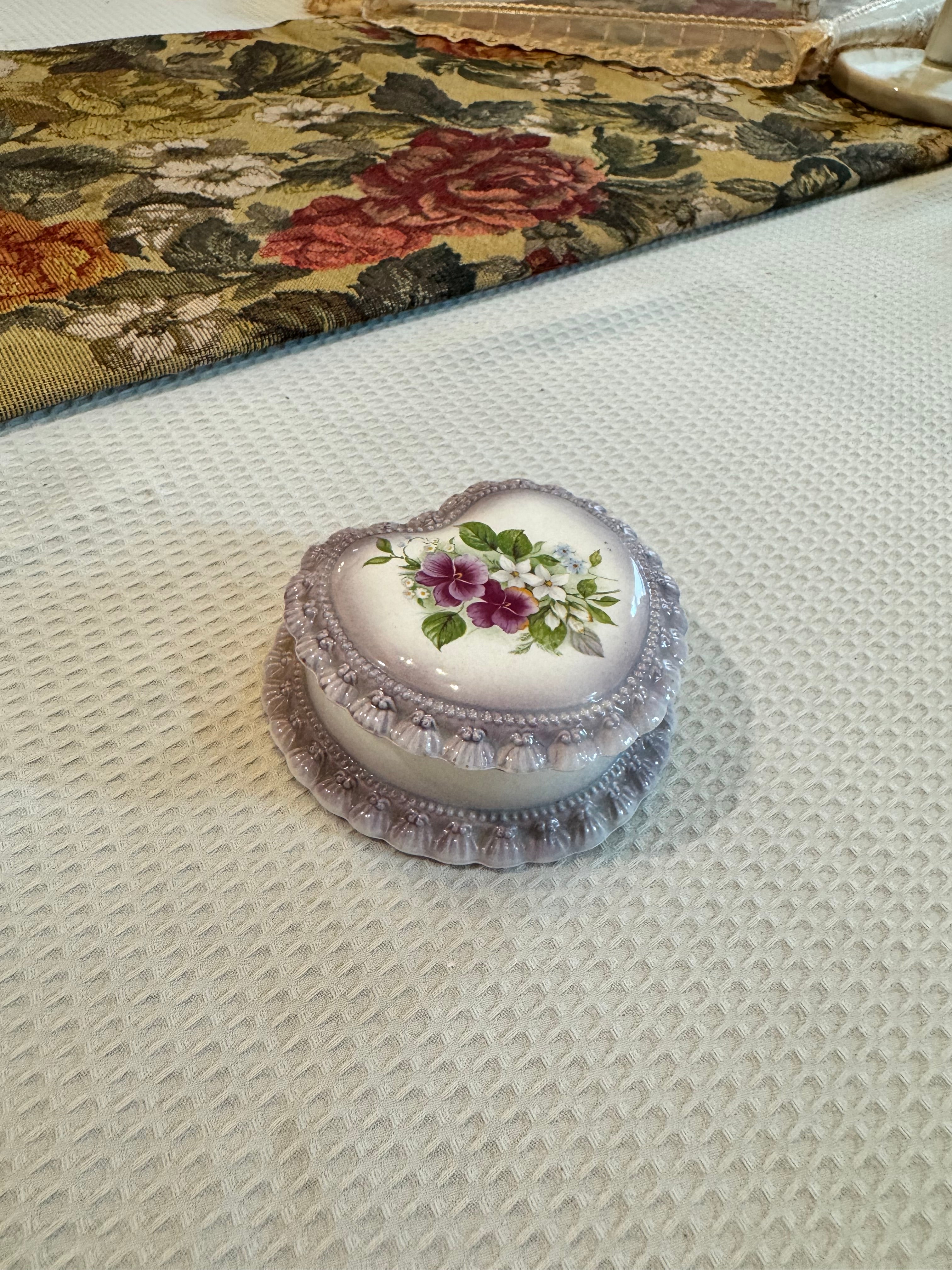Vintage-style porcelain or ceramic heart-shaped trinket box