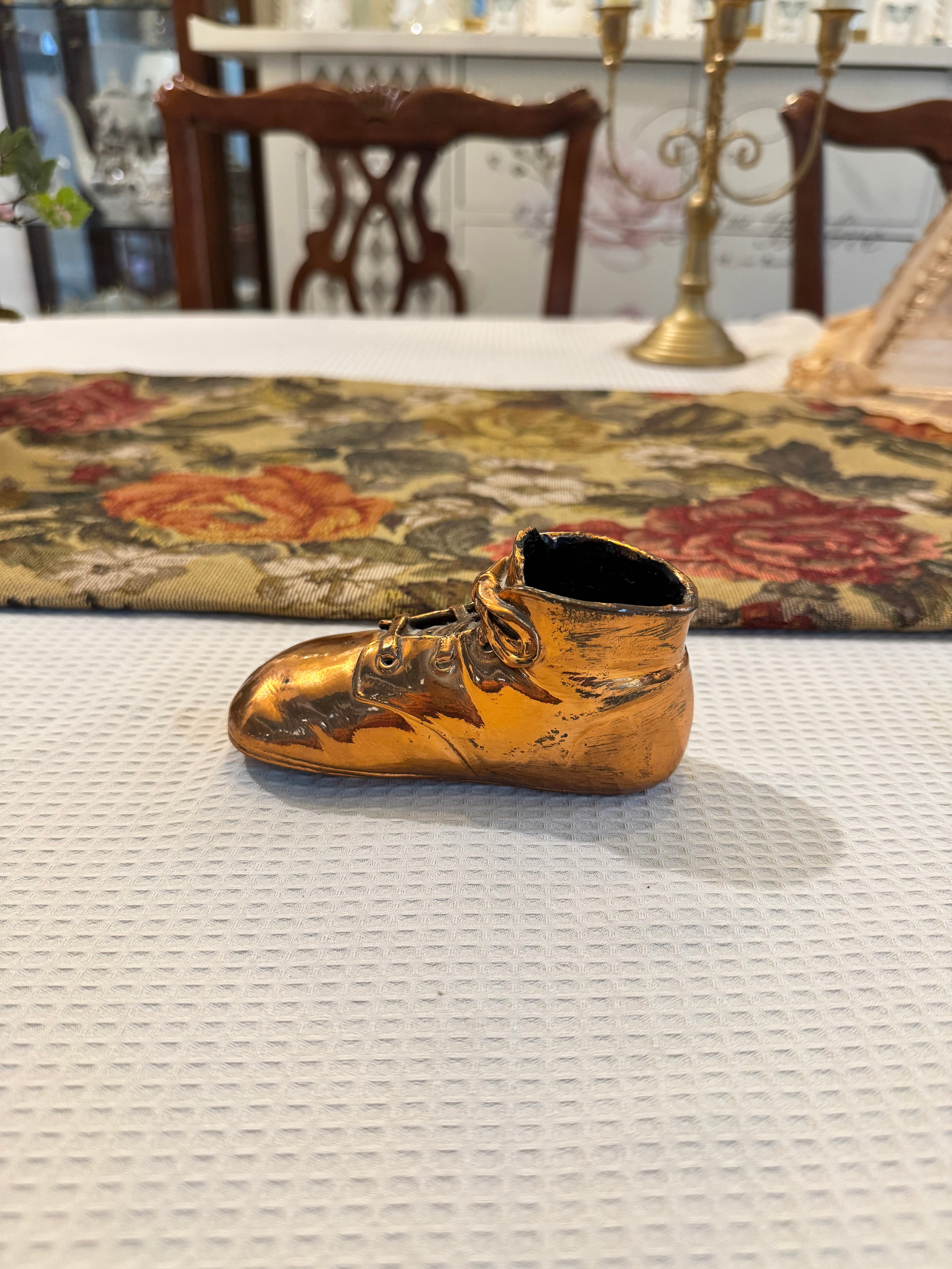 Vintage copper-dipped baby shoe
