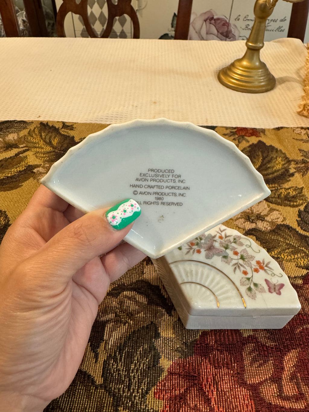A pair of vintage 1980 Avon porcelain fan-shaped trinket boxes