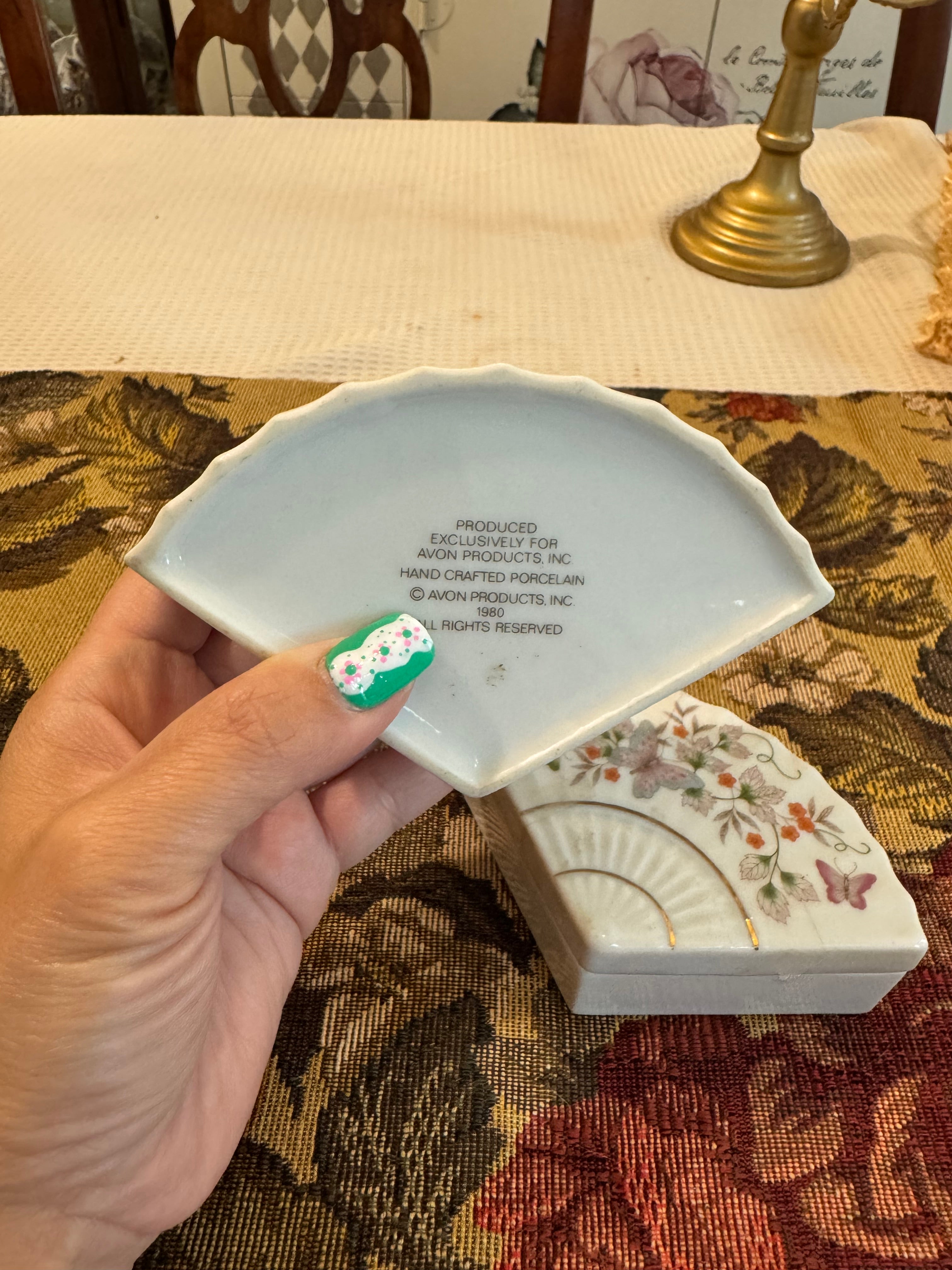 A pair of vintage 1980 Avon porcelain fan-shaped trinket boxes