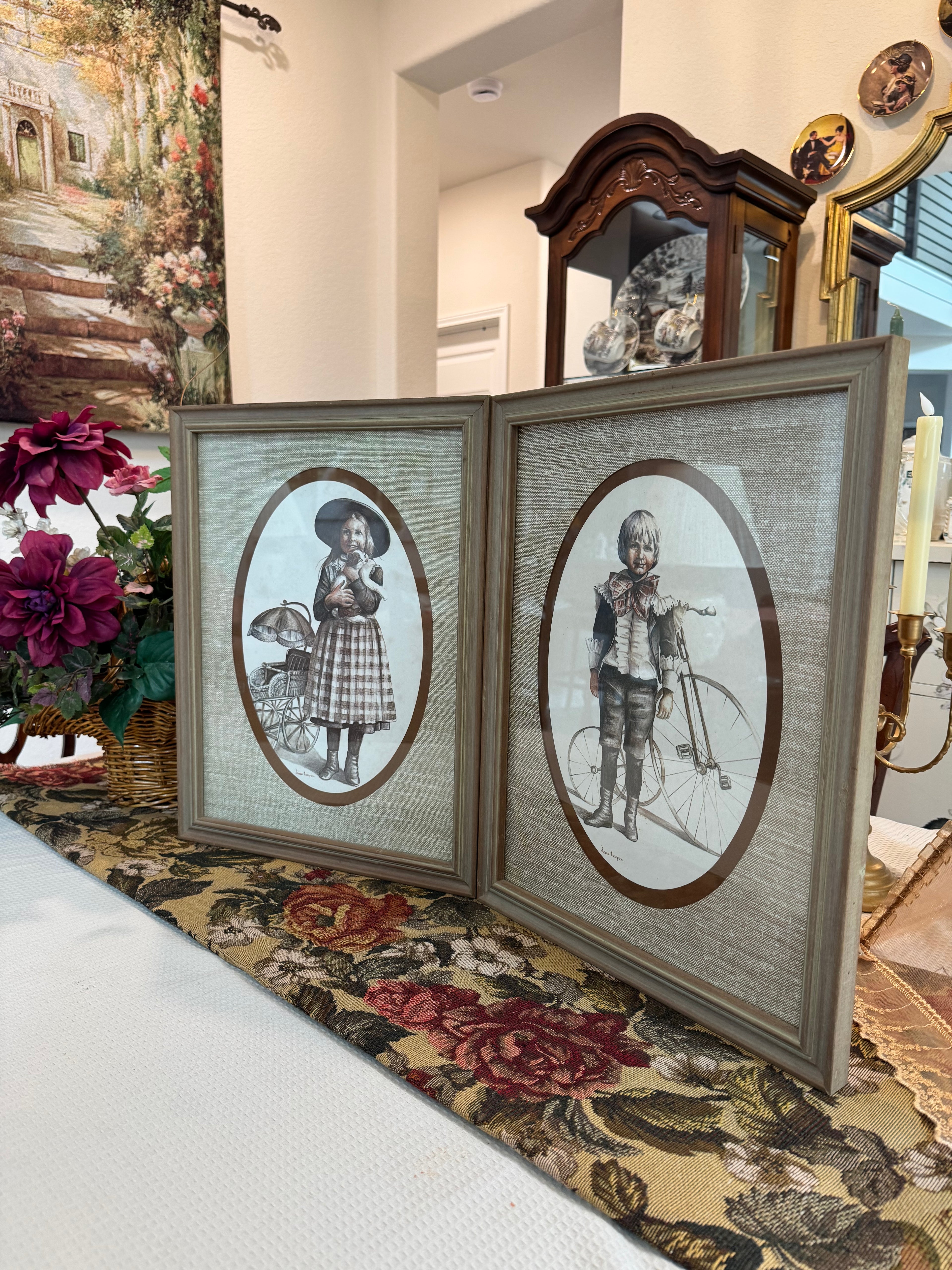 A pair of victorian framed prints boy and girl by artist Joanne Thompson