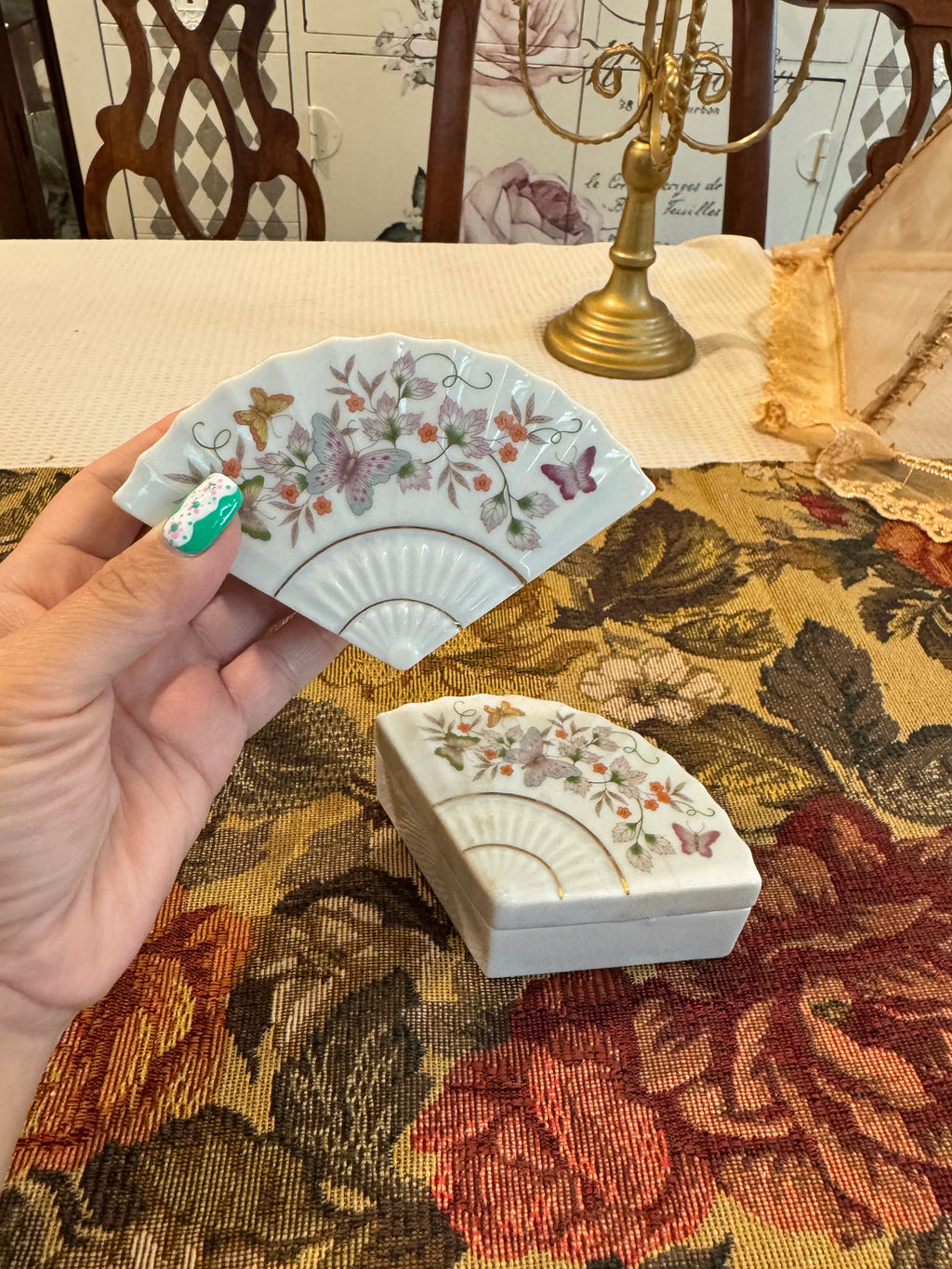 A pair of vintage 1980 Avon porcelain fan-shaped trinket boxes
