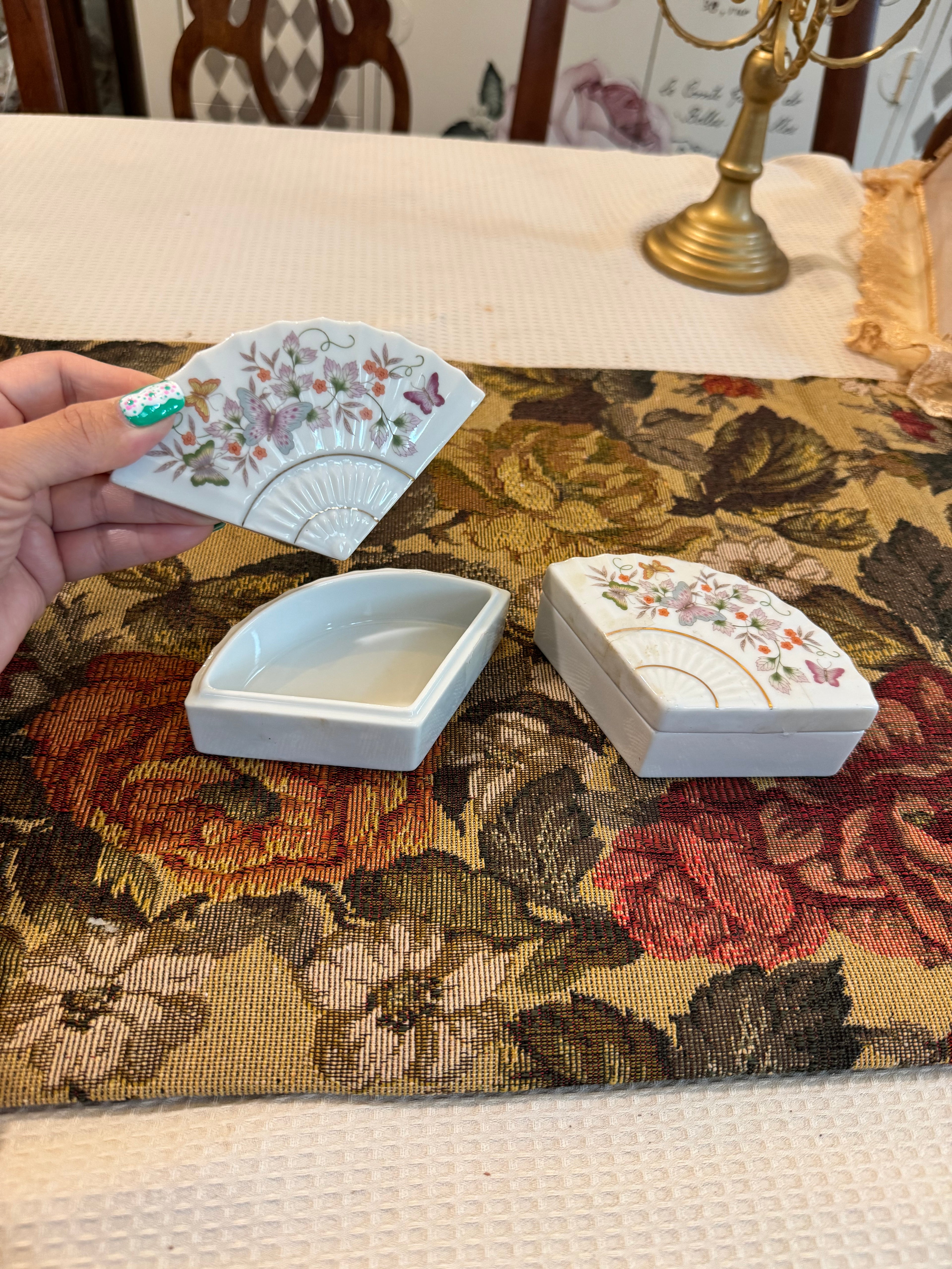 A pair of vintage 1980 Avon porcelain fan-shaped trinket boxes